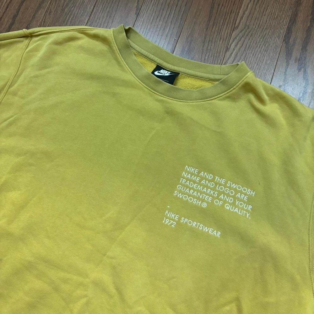 Nike embroidered crewneck sweatshirt yellow pullover sweater sleeve hits swoosh